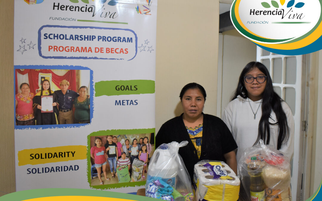 Providing bags of groceries to our scholarship students